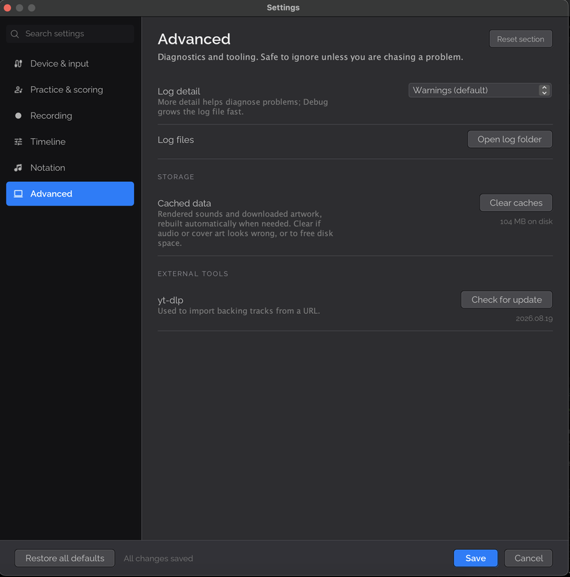 The Advanced page of Settings with a Log detail dropdown set to Warnings, an Open log folder button, a Clear caches button showing 104 MB on disk, and a yt-dlp Check for update button.